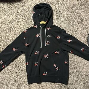 This is a NWT Nike Men's All Over Print Sportswear Hoodie